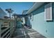 Comfortable outdoor deck area with seating and awning, ideal for enjoying outdoor activities at 923 Locust St, New Smyrna Beach, FL 32169