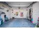 Well-lit garage with ample storage space and shelving for organization at 923 Locust St, New Smyrna Beach, FL 32169