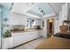 Bright kitchen with white cabinets, wood countertops, and under-cabinet lighting at 923 Locust St, New Smyrna Beach, FL 32169
