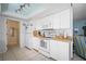 Efficient white kitchen with wood countertops and direct access to living room at 923 Locust St, New Smyrna Beach, FL 32169