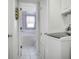 The laundry area conveniently provides easy access to the bathroom at 923 Locust St, New Smyrna Beach, FL 32169