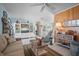 Inviting living room with coastal accents, a cozy sofa, and an entertainment center with a TV at 923 Locust St, New Smyrna Beach, FL 32169