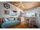Nautical-themed living room with a wet bar, daybed, wood plank ceiling, and beach-inspired decorations at 923 Locust St, New Smyrna Beach, FL 32169
