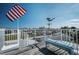 Rooftop deck offers clear views of the surrounding area and an American flag at 923 Locust St, New Smyrna Beach, FL 32169