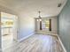 This dining room is bright with an interesting chandelier at 950 Sand Crest Dr, Port Orange, FL 32127