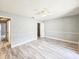 This main bedroom has updated flooring and walls along with an ensuite bathroom at 950 Sand Crest Dr, Port Orange, FL 32127