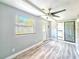 Bright sunroom features large windows at 950 Sand Crest Dr, Port Orange, FL 32127