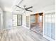 Bright sunroom features large windows and open doorway at 950 Sand Crest Dr, Port Orange, FL 32127