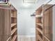 This walk-in closet features custom shelving and ample storage space at 950 Sand Crest Dr, Port Orange, FL 32127