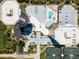 This is an aerial shot of a residential condominium building, parking area, swimming pool and tennis courts at 1 Oceans West Blvd # 6A5, Daytona Beach, FL 32118