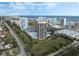 Aerial view of waterfront condo towers with pool and tennis court, ocean views, and well-manicured grounds at 1 Oceans West Blvd # 6A5, Daytona Beach, FL 32118