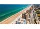 An aerial view of a residential area including condominiums, the beach, and the ocean at 1 Oceans West Blvd # 6A5, Daytona Beach, FL 32118