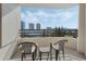 Balcony showcasing seating and scenic views of the surrounding cityscape and water at 1 Oceans West Blvd # 6A5, Daytona Beach, FL 32118