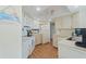 Cozy kitchen featuring white appliances, ample cabinet space and bright overhead lighting at 1 Oceans West Blvd # 6A5, Daytona Beach, FL 32118