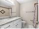 Clean bathroom featuring granite countertops, a modern vanity, and a tiled shower at 1039 Beulah Dr, Edgewater, FL 32132