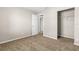 Bedroom showcasing neutral walls, plush carpeting, and an open closet at 1039 Beulah Dr, Edgewater, FL 32132