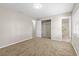 Comfortable bedroom with neutral walls, plush carpeting, and a closet and bathroom at 1039 Beulah Dr, Edgewater, FL 32132