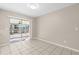 Bright tiled dining area with sliding door access to the screened patio at 1039 Beulah Dr, Edgewater, FL 32132