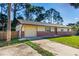 View of the house showing the garage, driveway, and front entrance at 1039 Beulah Dr, Edgewater, FL 32132