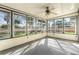 Glass sunroom with views of backyard at 1039 Beulah Dr, Edgewater, FL 32132