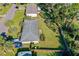 Aerial view of home, fenced yard, trailer, and mature trees create serene, secluded outdoor space at 1043 Beulah Dr, Edgewater, FL 32132