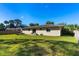 Large, fenced-in backyard with a green lawn, perfect for outdoor activities and relaxation at 1043 Beulah Dr, Edgewater, FL 32132