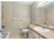 Bathroom with shower and tub, vanity, toilet and light tiled walls at 1043 Beulah Dr, Edgewater, FL 32132