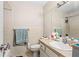 Bathroom featuring a sink, a toilet, and a shower head with white tiling at 1043 Beulah Dr, Edgewater, FL 32132