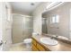 Cozy bathroom features a walk-in shower with glass doors, a vanity, and a toilet at 1043 Beulah Dr, Edgewater, FL 32132