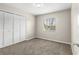Bedroom with neutral carpet, a window with blinds, and double door closet at 1043 Beulah Dr, Edgewater, FL 32132