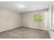 Inviting bedroom with neutral walls, carpet flooring, and a window for natural light at 1043 Beulah Dr, Edgewater, FL 32132