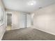 Comfortable bedroom featuring neutral walls, carpet flooring, closet space, and an attached bathroom at 1043 Beulah Dr, Edgewater, FL 32132