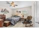 Cozy bedroom with a ceiling fan, window and ample natural light at 1043 Beulah Dr, Edgewater, FL 32132