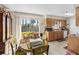 Eat-in kitchen area with natural light and a view of the backyard through a sliding glass door at 1043 Beulah Dr, Edgewater, FL 32132