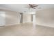 Open-concept living room features neutral walls, tile flooring, and seamless transition to other areas at 1043 Beulah Dr, Edgewater, FL 32132