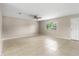 Spacious living room with neutral walls, tile floors, and a window providing ample natural light at 1043 Beulah Dr, Edgewater, FL 32132