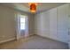 Neutral bedroom features a striking paneled accent wall and plush carpet at 1100 Loch Linnhe Ct, New Smyrna Beach, FL 32168