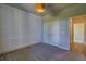 Bedroom with stylish accent wall, gray carpet, and closet leading to hallway at 1100 Loch Linnhe Ct, New Smyrna Beach, FL 32168