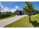 Exterior of home featuring driveway leading to a gray single car garage at 1100 Loch Linnhe Ct, New Smyrna Beach, FL 32168