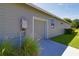 Rear view of home exterior showing water heater at 1100 Loch Linnhe Ct, New Smyrna Beach, FL 32168