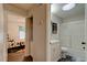 Hallway leading to an adjoining bathroom with shower/tub combo and vanity at 1140 Fairvilla Dr, New Smyrna Beach, FL 32168