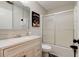 Bathroom featuring an enclosed shower/tub, a vanity, and wood floors at 1140 Fairvilla Dr, New Smyrna Beach, FL 32168