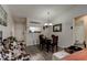 Dining area with wood floors, chandelier and is open to the living area creating an open floorplan at 1140 Fairvilla Dr, New Smyrna Beach, FL 32168