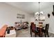 Open floor plan dining area featuring modern chandelier and wood look floors at 1140 Fairvilla Dr, New Smyrna Beach, FL 32168