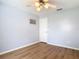 Spacious bedroom with hardwood floors, ceiling fan, and a neutral wall color at 1175 Margina Ave, Daytona Beach, FL 32114