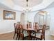 Formal dining room with wood table and chairs and decorative chandelier at 1175 Margina Ave, Daytona Beach, FL 32114