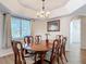 Dining room with view of a backyard through a large window, and a chandelier at 1175 Margina Ave, Daytona Beach, FL 32114