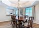 Elegant dining room with a chandelier and views into the kitchen, perfect for gatherings at 1175 Margina Ave, Daytona Beach, FL 32114