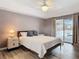 This is the Main bedroom featuring gray walls and sliding glass doors that open up to the pool at 1175 Margina Ave, Daytona Beach, FL 32114