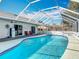 This beautiful screened-in pool area has plenty of space for outdoor entertaining at 1175 Margina Ave, Daytona Beach, FL 32114